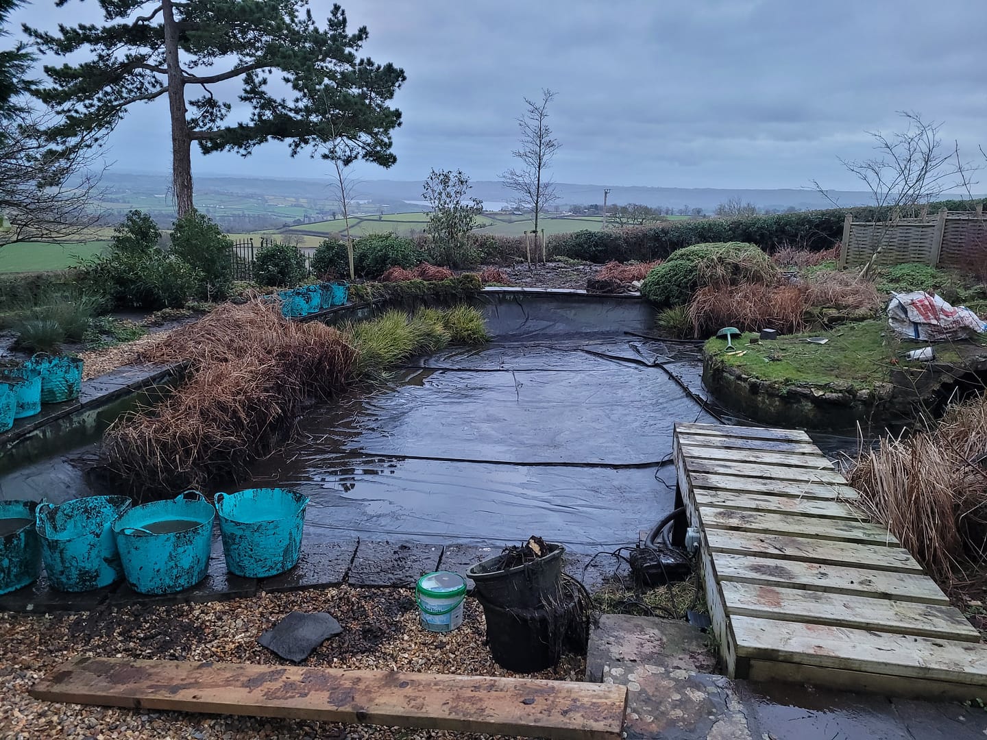 Large lined garden pond in South Bristol, drained and cleaned back to bare liner by hand.